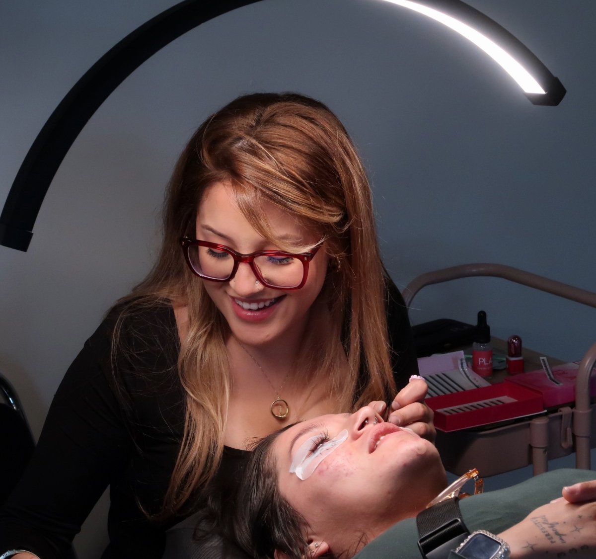 Lash student smiling during class